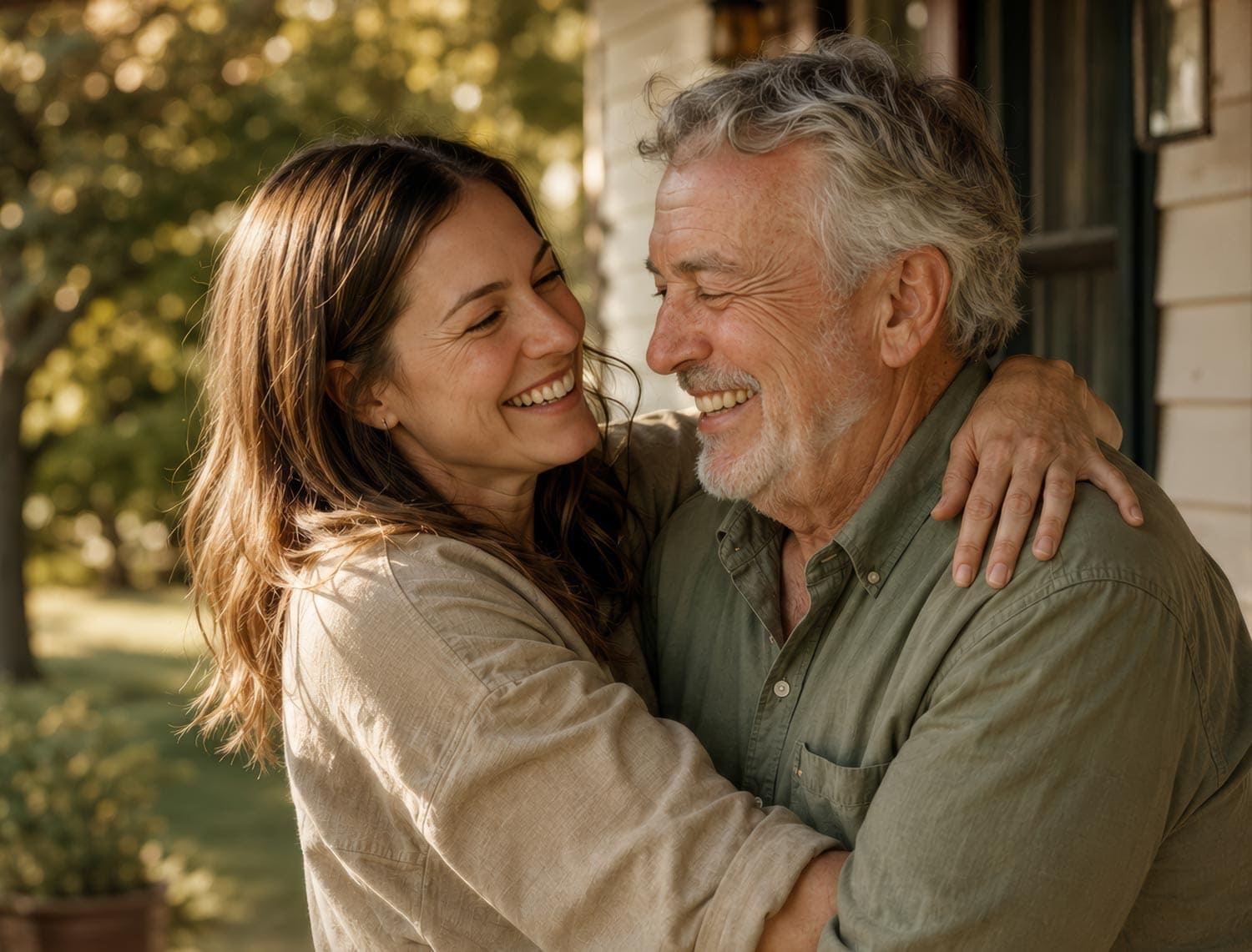 Happy daughter hugging her father outdoors on Father's Day.